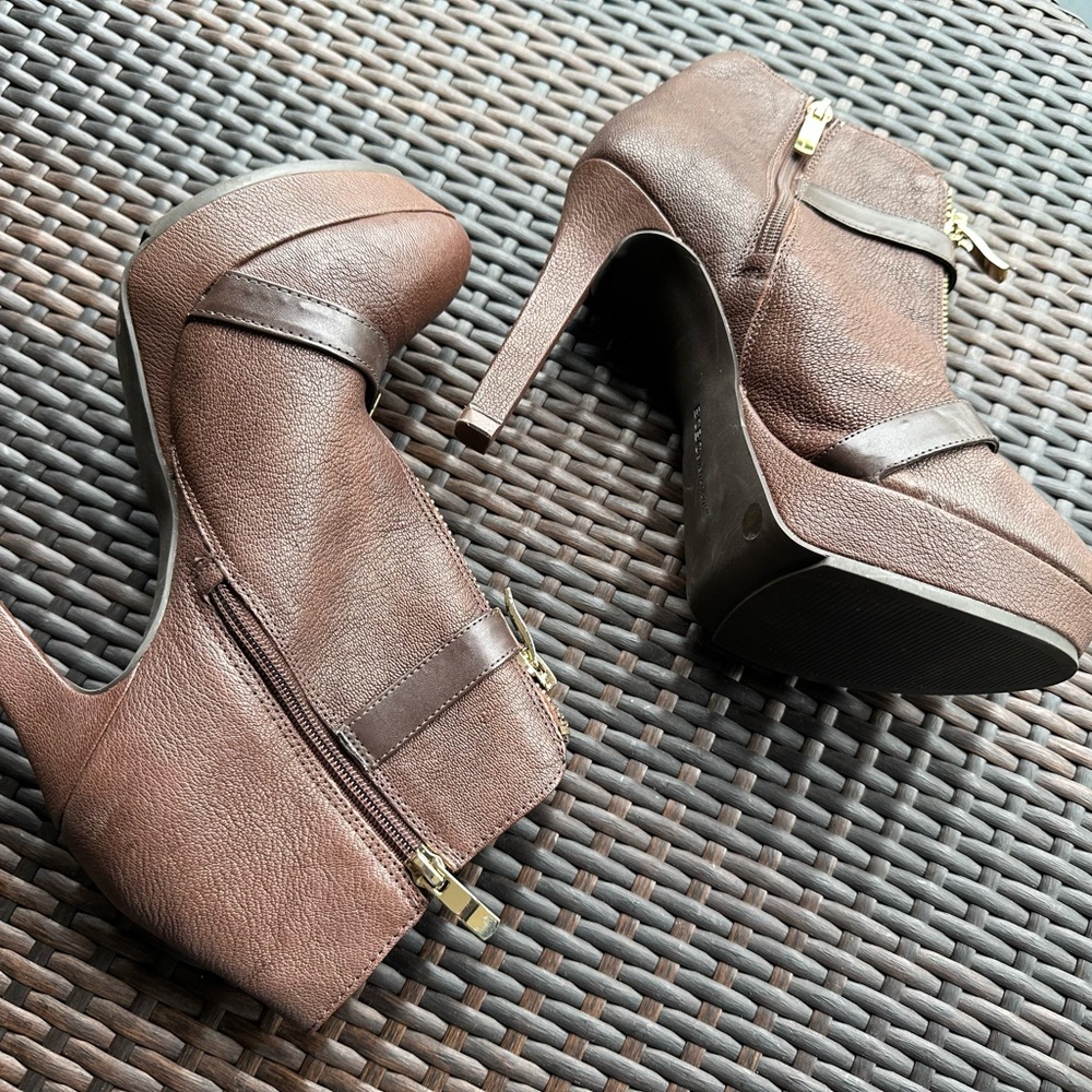 Brown bootie by BCBG size 9 4 inch heel with 2 buckles across.